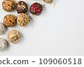 Set of round chocolate candies with nuts on a white background 109060518