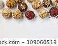 Set of round chocolate candies with nuts on a white background 109060519