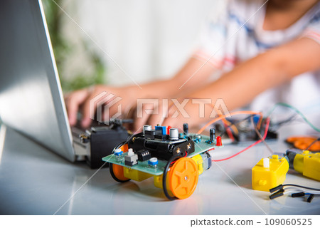 Asian kid boy learns coding and programming with laptop for Arduino robot car, Little child students typing code in computer with car toy, STEAM education AI technology course school learning Asian kid boy learns coding and programming with laptop for Arduino robot car, Little child students typing code in computer with car toy, STEAM education AI technology course school learning 109060525