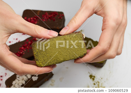 Woman holding vegan chocolate bar 109060529