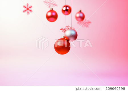 Abstract New Year and Christmas concept. New Year's balls are metallic silver and red. Balls hang on red strings. Red decorative flakes. A simple idea.  Pastel pink and lilac background. 109060596
