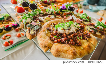 Catering buffet table with a delicious food Catering buffet table with a delicious food 109060653