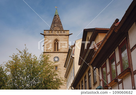 spring trip to Europe. Travel and German sightseeing locations. interesting ancient towers and facades of medieval houses somewhere in Erfurt city spring trip to Europe. Travel and German sightseeing locations. interesting ancient towers and facades of medieval houses somewhere in Erfurt city 109060682