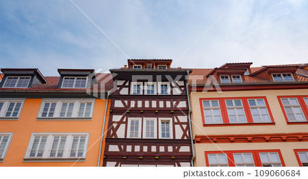 spring trip to Europe. Travel and German sightseeing locations. scenic view to facade of old historic houses somewhere in Erfurt city, Traditional half-timbered houses makes cozy and fairy tail mood 109060684