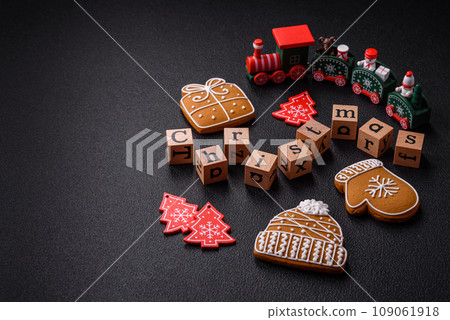 Beautiful Christmas composition with copy space with an inscription in wooden cubes Beautiful Christmas composition with copy space with an inscription in wooden cubes 109061918
