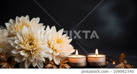white chrysanthemums on a black background with candles, funeral concept 109062340