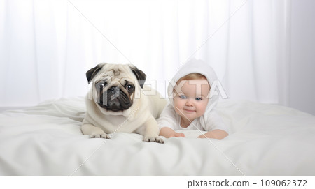 Little child and dog lying on snow-white bed next to each other 109062372