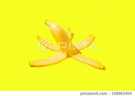 Peel of a ripe yellow banana on a yellow background Peel of a ripe yellow banana on a yellow background 109063404