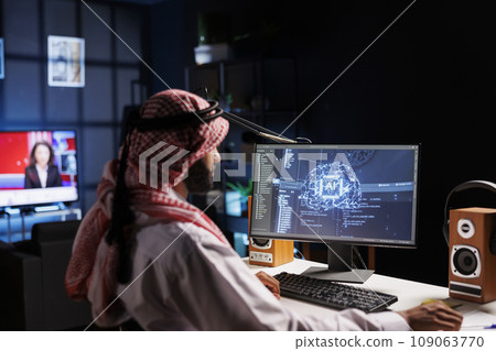 An Arabian engineer examining data and ensuring cybersecurity. With expertise in information technology and programming, he develops software for machine learning and quantum computing. 109063770