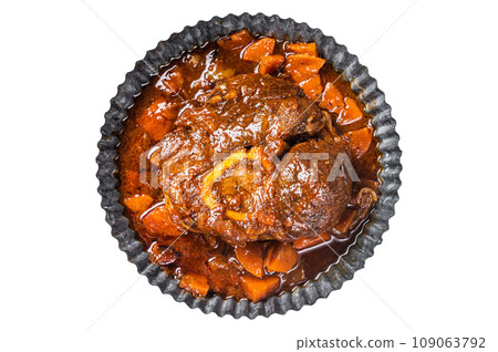 Braised meat on the bone Osso Buco in tomato sauce, veal italian meat Ossobuco. Isolated, white background. Braised meat on the bone Osso Buco in tomato sauce, veal italian meat Ossobuco. Isolated, white background. 109063792