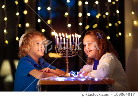 Kids celebrating Hanukkah. Festival of lights. 109064017