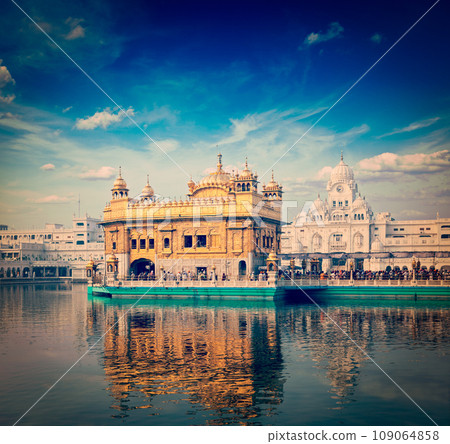 Vintage retro hipster style travel image of famous India attraction Sikh gurdwara Golden Temple (Harmandir Sahib). Amritsar, Punjab, India 109064858