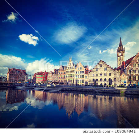 Vintage retro hipster style travel image of Europe Belgium medieval town travel background - Ghent canal and Graslei street on sunset. Ghent, Belgium 109064941