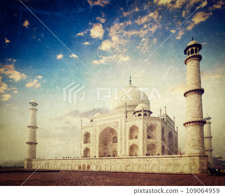 Vintage retro hipster style travel image of Taj Mahal on sunrise. Indian Symbol - India travel background with grunge texture overlaid. Agra, India Vintage retro hipster style travel image of Taj Mahal on sunrise. Indian Symbol - India travel background with grunge texture overlaid. Agra, India 109064959