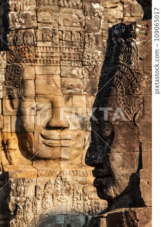 Ancient stone faces of Bayon temple, Angkor, Cambodia 109065017