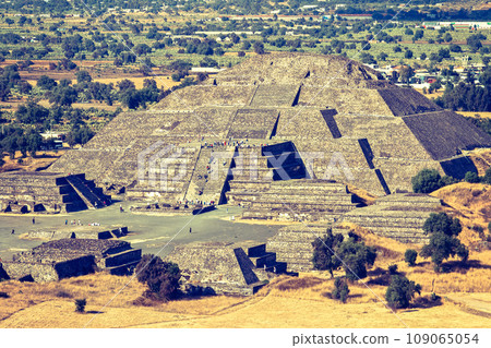 Vintage retro hipster style travel image of Pyramid of the Moon. View from the Pyramid of the Sun. Teotihuacan, Mexico Vintage retro hipster style travel image of Pyramid of the Moon. View from the Pyramid of the Sun. Teotihuacan, Mexico 109065054