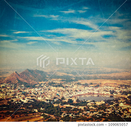 Vintage retro hipster style travel image of Holy city Pushkar aerial view from Savitri temple with grunge texture overlaid. Rajasthan, India 109065057