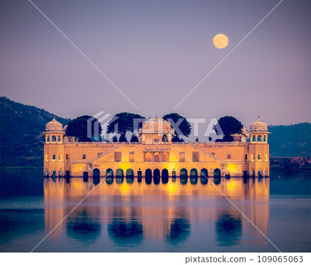 Vintage retro hipster style travel image of Rajasthan landmark - Jal Mahal (Water Palace) on Man Sagar Lake in the evening in twilight. Jaipur, Rajasthan, India Vintage retro hipster style travel image of Rajasthan landmark - Jal Mahal (Water Palace) on Man Sagar Lake in the evening in twilight. Jaipur, Rajasthan, India 109065063