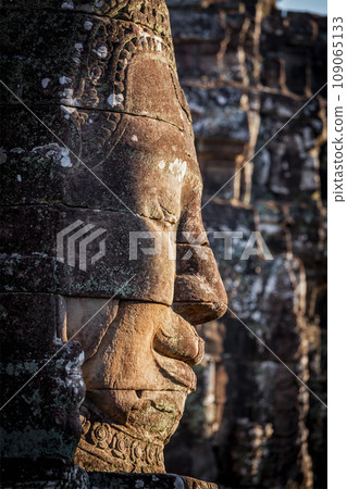 Ancient stone face of Bayon temple, Angkor, Cambodia 109065133