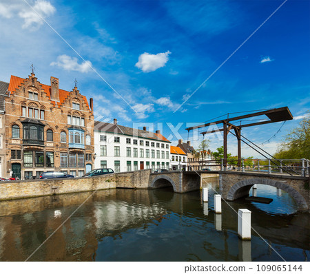 Canal with old bridge. Bruges (Brugge), Belgium 109065144