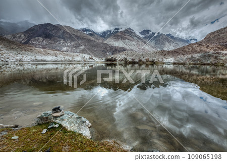 Sacred mountain lake Lohan Tso in Himalayas. Nubra valley, Ladakh, Jammu and Kashmir, India Sacred mountain lake Lohan Tso in Himalayas. Nubra valley, Ladakh, Jammu and Kashmir, India 109065198