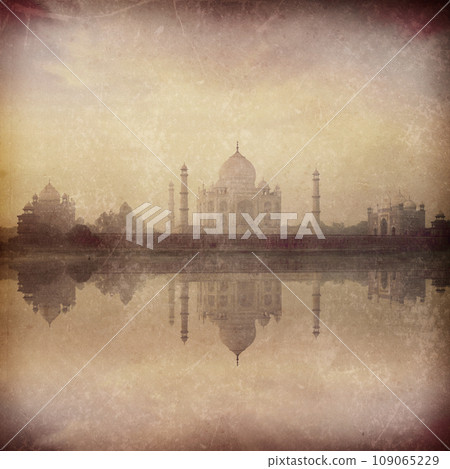 Vintage retro hipster style image of Taj Mahal on sunrise reflection in Yamuna river panorama in fog, Indian Symbol - India travel background with grunge texture overlaid. Agra, Uttar Pradesh, India Vintage retro hipster style image of Taj Mahal on sunrise reflection in Yamuna river panorama in fog, Indian Symbol - India travel background with grunge texture overlaid. Agra, Uttar Pradesh, India 109065229