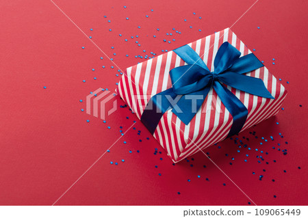 Gift box on color background, flat lay, space for text Gift box on color background, flat lay, space for text 109065449