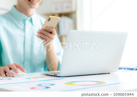 Young man having an online meeting on telework Young man having an online meeting on telework 109065944