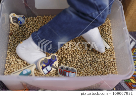 Child massaging feet 109067951