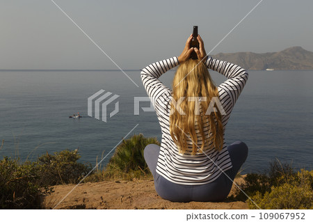 Woman meditating with beer Woman meditating with beer 109067952