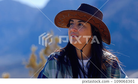 Young woman in a western style outfit exploring the amazing Red Rock Canyon in Nevada 109068301