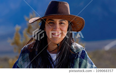 Young woman in a western style outfit exploring the amazing Red Rock Canyon in Nevada 109068357