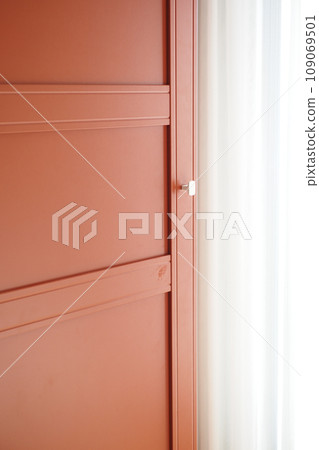 opening bedroom cabinet door at home  109069501