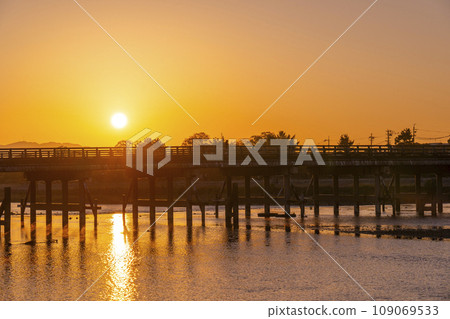 Arashiyama Togetsukyo Bridge bathed in the morning glow in Kyoto in autumn 109069533