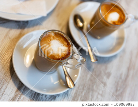 Mug of cortado served on table in cafe 109069982