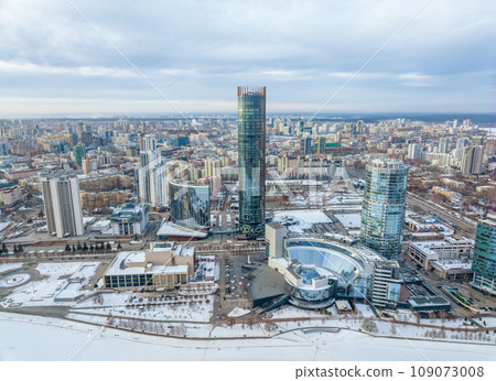 Yekaterinburg aerial panoramic view in Winter at sunset. Ekaterinburg is the fourth largest city in Russia located in the Eurasian continent on the border of Europe and Asia. Yekaterinburg aerial panoramic view in Winter at sunset. Ekaterinburg is the fourth largest city in Russia located in the Eurasian continent on the border of Europe and Asia. 109073008