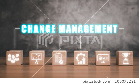 Change management concept, Wooden block on desk with change management icon on virtual screen. Change management concept, Wooden block on desk with change management icon on virtual screen. 109073281