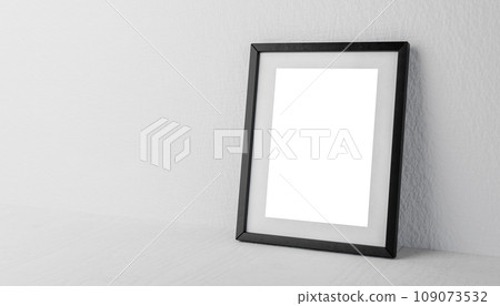 photo frame mockup against neutral plaster background. black photo frame mockup with blank white sheet on gray shelf photo frame mockup against neutral plaster background. black photo frame mockup with blank white sheet on gray shelf 109073532