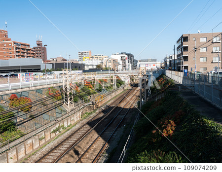 A clear autumn sky overlooking Sengawa Station on the Keio Line, Chofu City, Tokyo A clear autumn sky overlooking Sengawa Station on the Keio Line, Chofu City, Tokyo 109074209