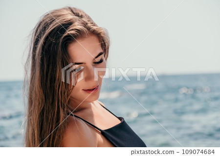Woman summer travel sea. Happy tourist in hat enjoy taking picture outdoors for memories. Woman traveler posing on the beach at sea surrounded by volcanic mountains, sharing travel adventure journey Woman summer travel sea. Happy tourist in hat enjoy taking picture outdoors for memories. Woman traveler posing on the beach at sea surrounded by volcanic mountains, sharing travel adventure journey 109074684