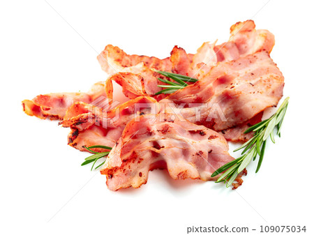 Fried bacon slices with rosemary isolated on white. 109075034