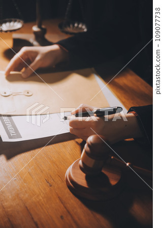 law books and scales of justice on desk in library of law firm. jurisprudence legal education concept. law books and scales of justice on desk in library of law firm. jurisprudence legal education concept. 109077738