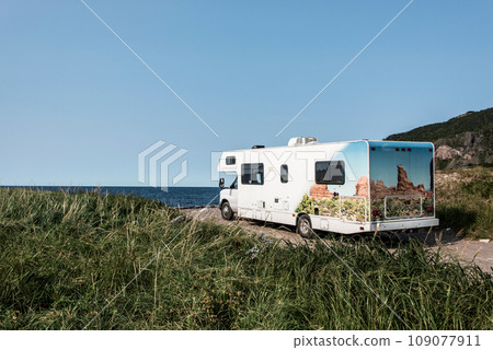 Camper RV truck parked at the Cape Breton Island Coast line cliff scenic Cabot Trail route, Nova Scotia Hghlands Canada Camper RV truck parked at the Cape Breton Island Coast line cliff scenic Cabot Trail route, Nova Scotia Hghlands Canada 109077911