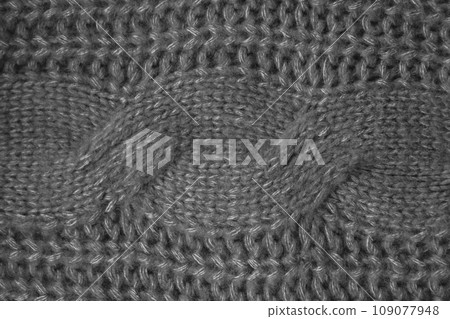 Handmade knitted background with macro weave threads. Handmade knitted background with macro weave threads. 109077948