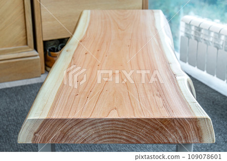 Live edge wooden bench with gray metal legs 109078601