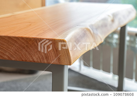 Live edge wooden bench with gray metal legs 109078608