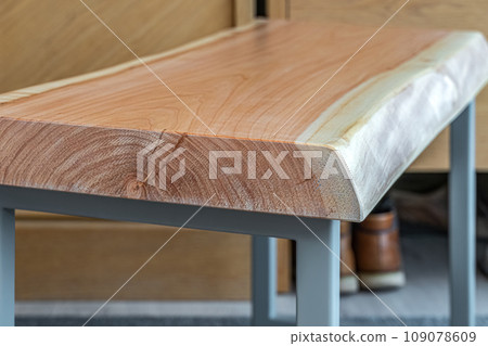 Live edge wooden bench with gray metal legs 109078609
