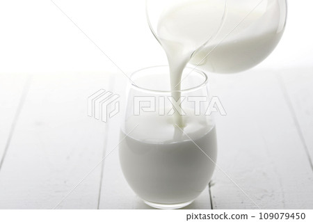 pour yogurt into a glass pour yogurt into a glass 109079450