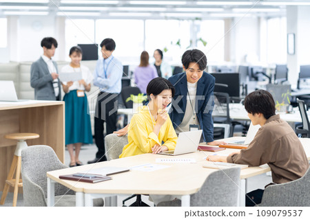 Young male and female engineers having a meeting in the office 109079537