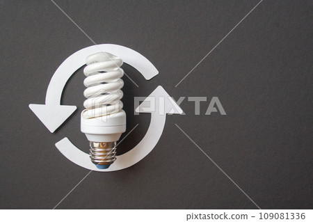Energy saving light bulb on a black background Energy saving light bulb on a black background 109081336